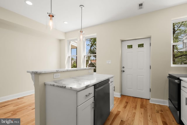 3827 Boarman Ave, Baltimore, MD 21215 - kitchen with electric range, light wood-style flooring, baseboards, recessed lighting, and a kitchen island