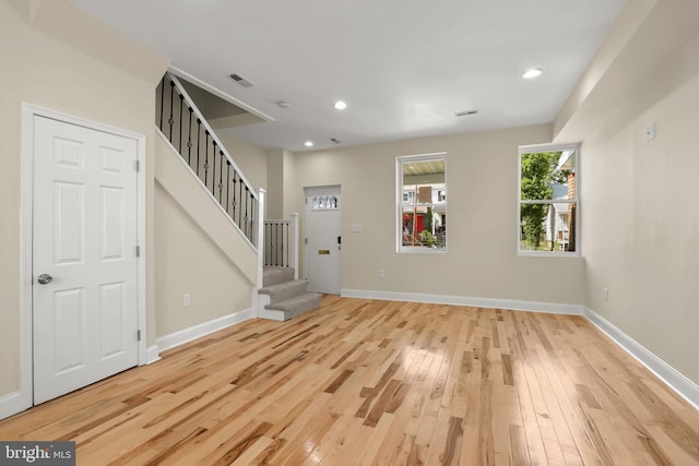 3827 Boarman Ave, Baltimore, MD 21215 - unfurnished living room featuring wood-type flooring, stairway, baseboards, and recessed lighting