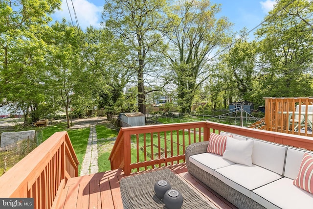3827 Boarman Ave, Baltimore, MD 21215 - wooden terrace with an outdoor living space, a storage unit, and view of scattered trees