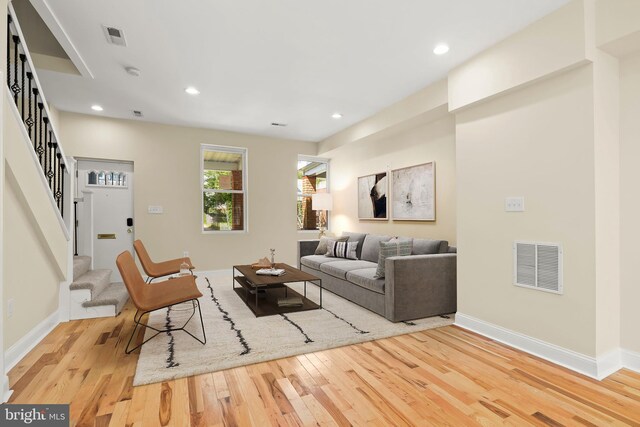 3827 Boarman Ave, Baltimore, MD 21215 - living room with wood finished floors, stairway, baseboards, and recessed lighting