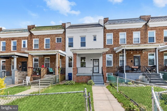 3827 Boarman Ave, Baltimore, MD 21215 - view of property featuring covered porch, brick siding, and a gate