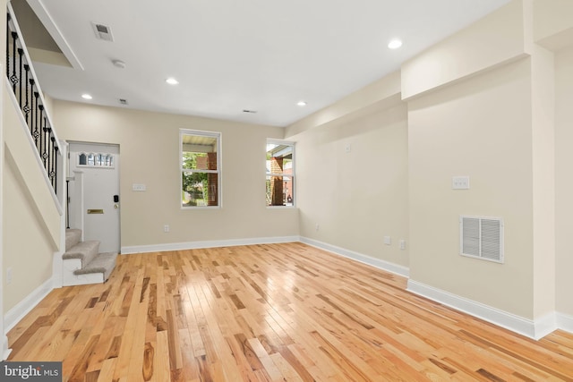 3827 Boarman Ave, Baltimore, MD 21215 - unfurnished living room featuring stairway, light wood-style flooring, recessed lighting, and baseboards