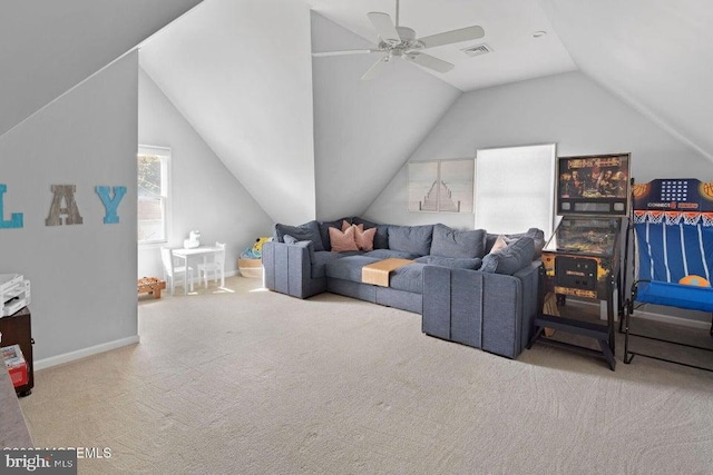 living room with carpet floors, ceiling fan, vaulted ceiling, and baseboards