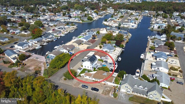 view of property location with nearby suburban area and a nearby body of water