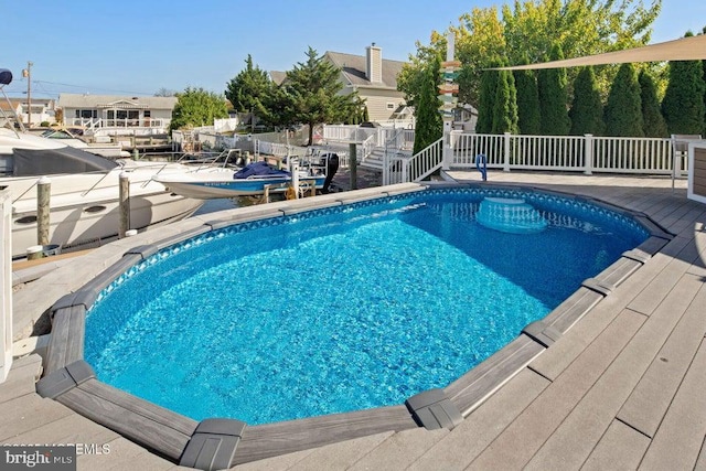 swimming pool featuring a deck and stairs