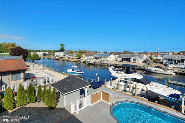 dock area with a water view and a residential view