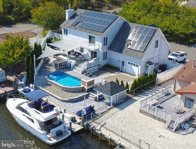 view of subject property featuring a pool area