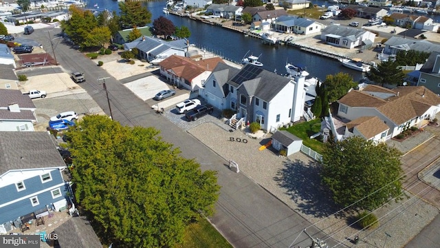 aerial view of residential area with a nearby body of water