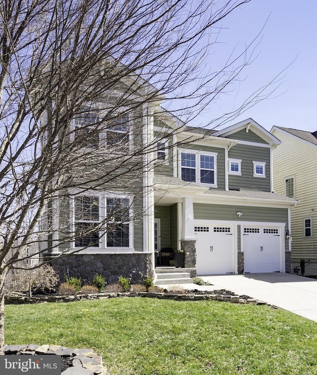 view of front of home with stone siding, concrete driveway, a front yard, and a garage