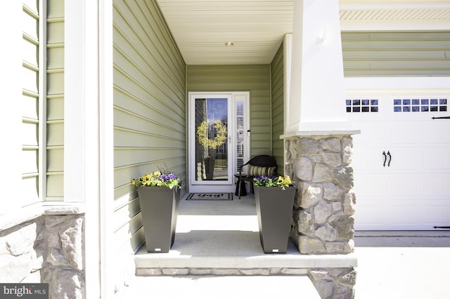 doorway to property with stone siding