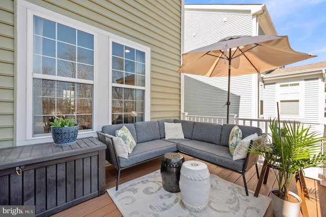 wooden terrace with outdoor lounge area