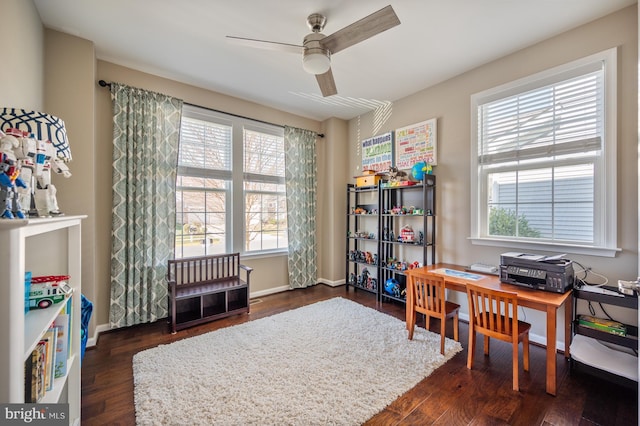 home office with ceiling fan, wood finished floors, and baseboards