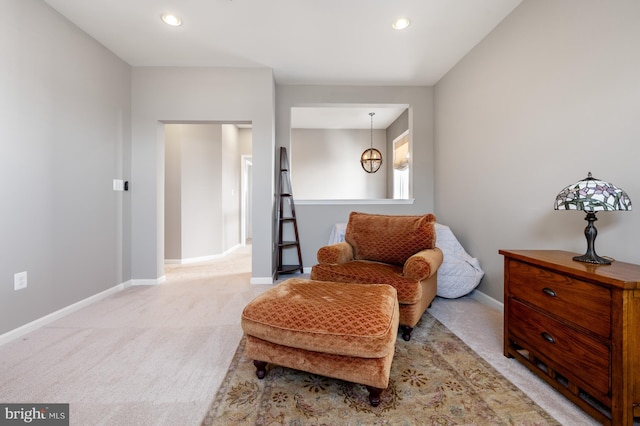 living area featuring carpet floors, baseboards, and recessed lighting