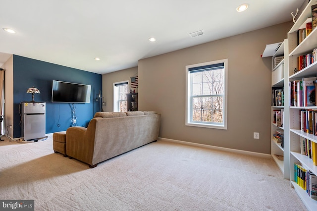 living area featuring carpet floors, recessed lighting, and baseboards