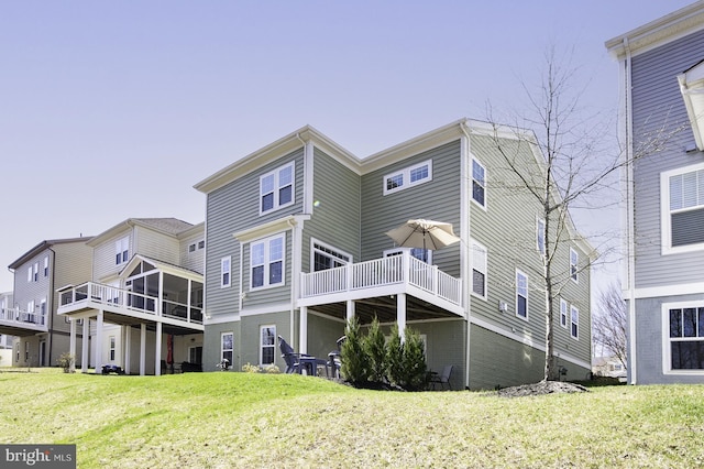back of house with a yard and a wooden deck