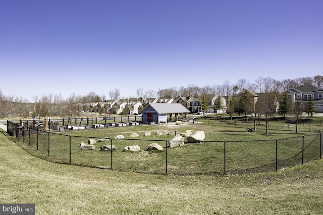 view of property's community featuring a dog friendly area and a residential view