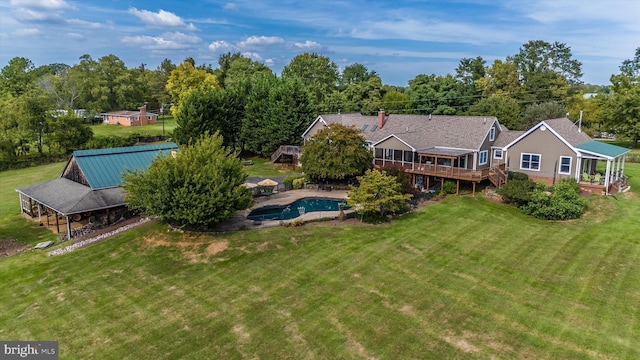 view of subject property featuring a pool