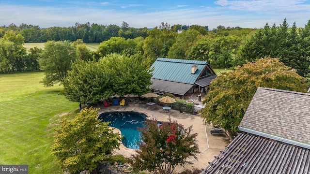 view of subject property featuring a pool area