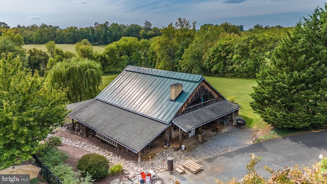 view from above of property featuring a heavily wooded area