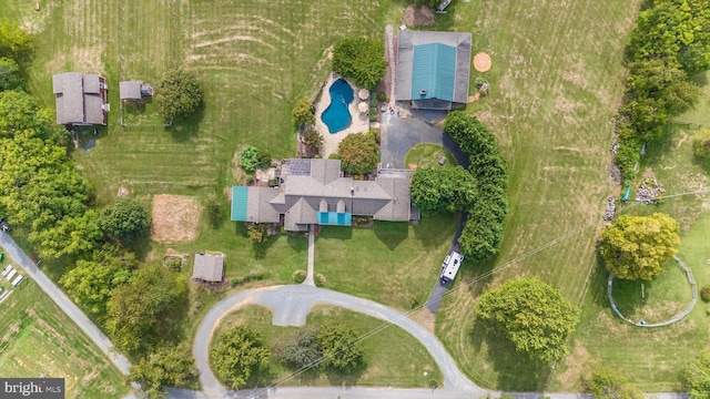 view of property location featuring a pool