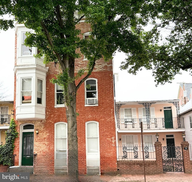 view of property featuring brick siding