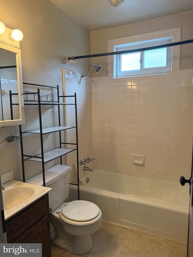 bathroom featuring bathing tub / shower combination, toilet, tile patterned floors, and vanity