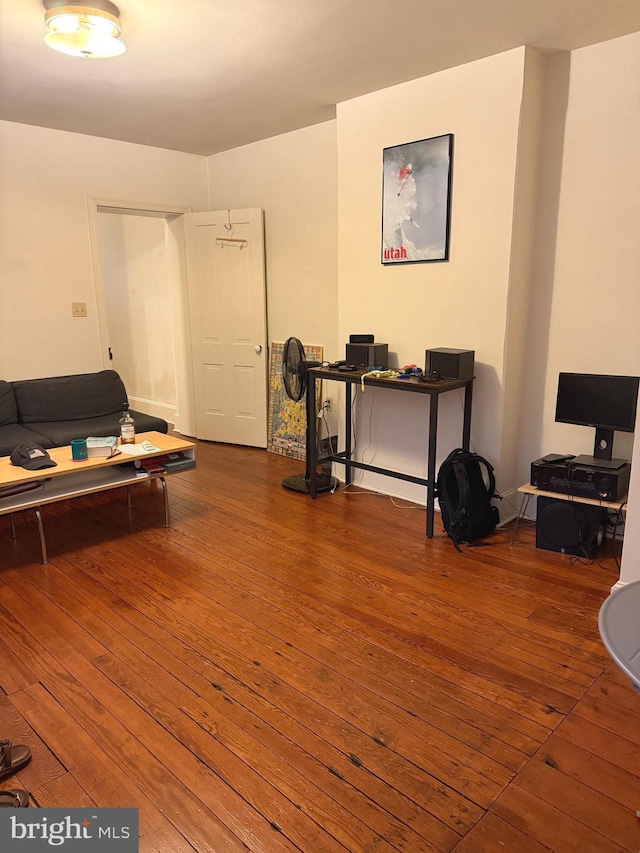 game room featuring hardwood / wood-style flooring and a desk