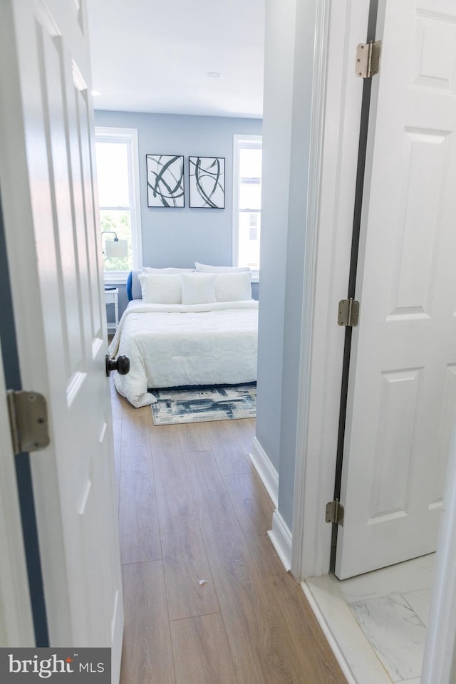 bedroom featuring baseboards