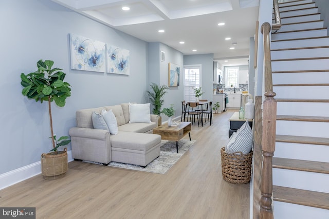 living area featuring light wood-style floors, stairs, recessed lighting, baseboards, and beam ceiling