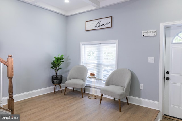 living area featuring light wood finished floors, baseboards, stairs, and recessed lighting