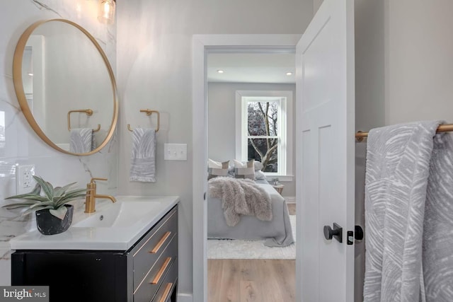 bathroom featuring wood finished floors and vanity