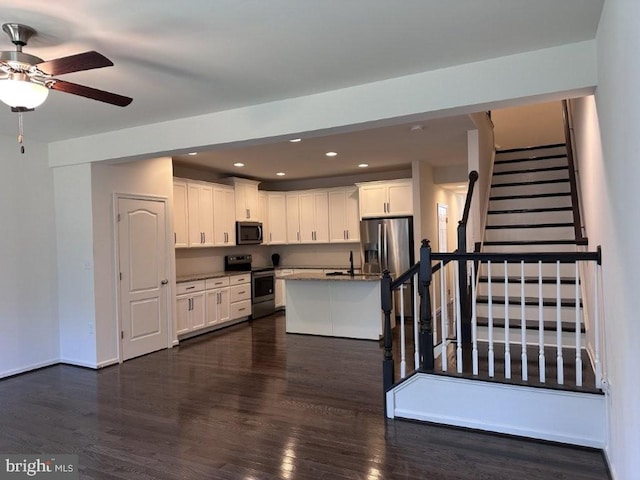 51 Healey Ct, Bunker Hill, WV 25413 - kitchen with appliances with stainless steel finishes, a sink, dark wood-type flooring, white cabinets, and recessed lighting