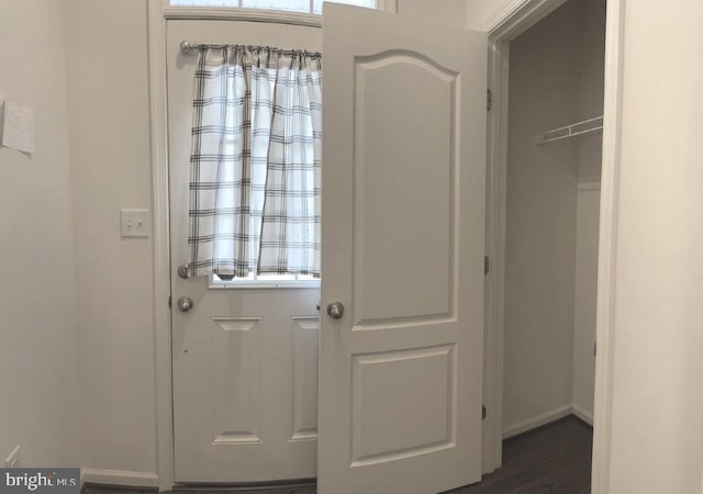 51 Healey Ct, Bunker Hill, WV 25413 - doorway with dark wood finished floors and baseboards