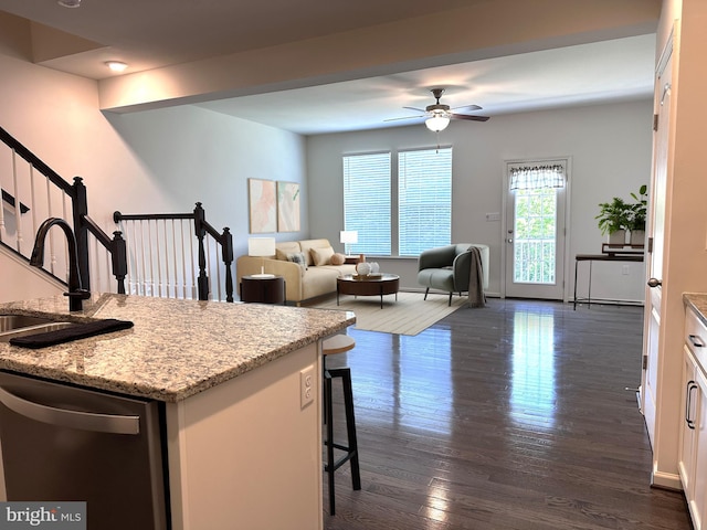 51 Healey Ct, Bunker Hill, WV 25413 - kitchen with dishwasher, a sink, a kitchen breakfast bar, ceiling fan, and white cabinets