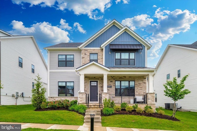 14013 Smoky Bell Ln, North Potomac, MD 20878 - craftsman inspired home with stone siding, board and batten siding, a porch, and a front yard