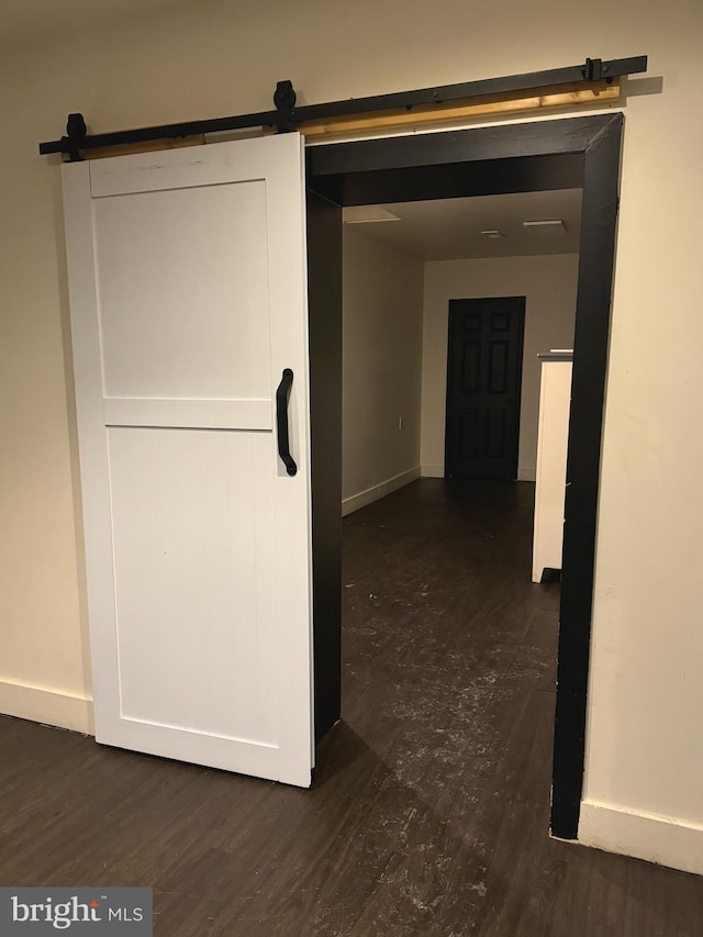 918 Ramsay St, Baltimore, MD 21223 - hallway featuring a barn door and wood finished floors