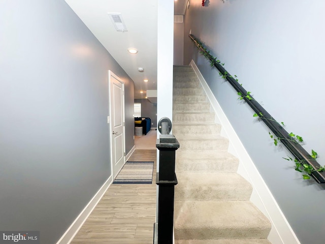11631 Dorothy Sayers Pl, White Plains, MD 20695 - staircase with wood finished floors, recessed lighting, and baseboards