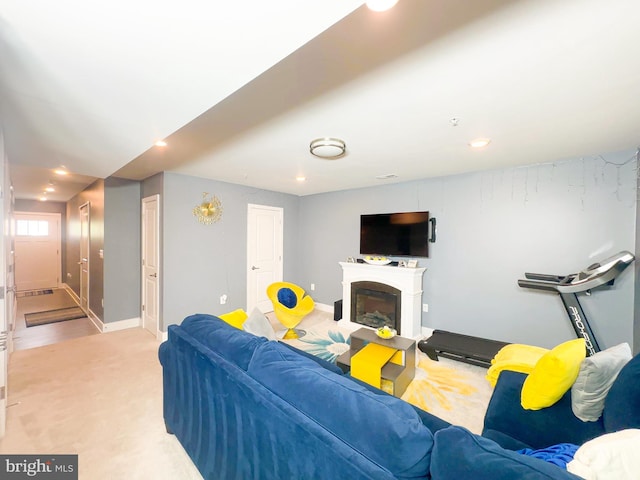11631 Dorothy Sayers Pl, White Plains, MD 20695 - living room with light carpet, recessed lighting, baseboards, and a glass covered fireplace