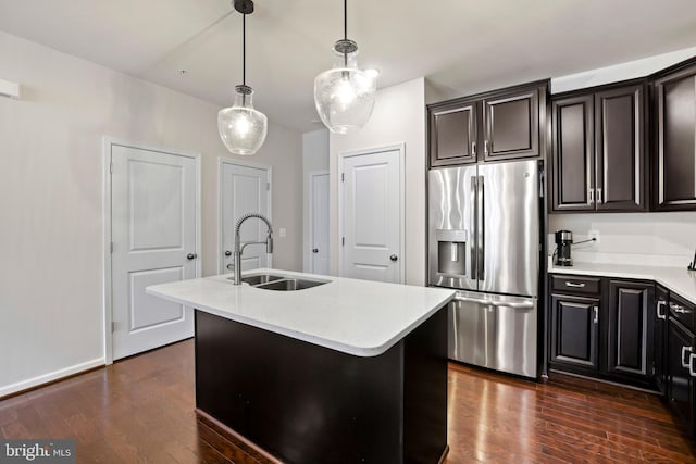 1102 Ribbon Limestone Ter SE, Leesburg, VA 20175 - kitchen with stainless steel refrigerator with ice dispenser, a sink, light countertops, and a center island with sink