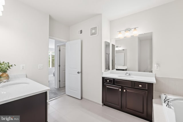 1102 Ribbon Limestone Ter SE, Leesburg, VA 20175 - bathroom featuring two vanities and a tub