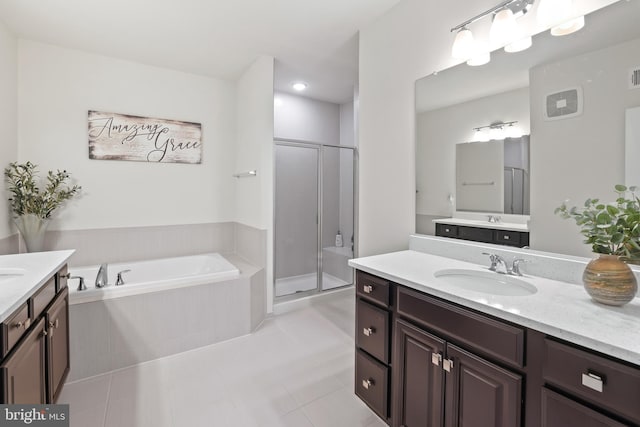 1102 Ribbon Limestone Ter SE, Leesburg, VA 20175 - bathroom with a stall shower, two vanities, a garden tub, and tile patterned flooring
