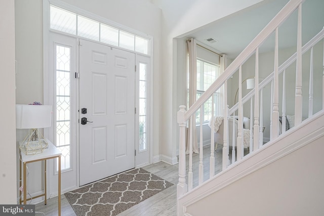 1094 Chews Landing Rd, Laurel Springs, NJ 08021 - entrance foyer featuring plenty of natural light, stairs, wood finished floors, and baseboards