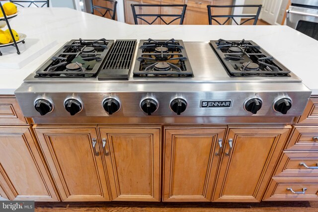 20550 Wildbrook Ct, Ashburn, VA 20147 - detailed view of appliances with stainless steel finishes, brown cabinets, and light countertops