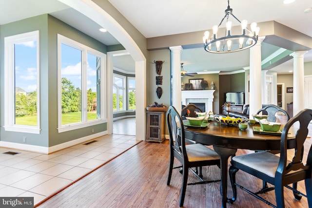 20550 Wildbrook Ct, Ashburn, VA 20147 - dining area featuring baseboards, hardwood / wood-style flooring, a fireplace, decorative columns, and recessed lighting