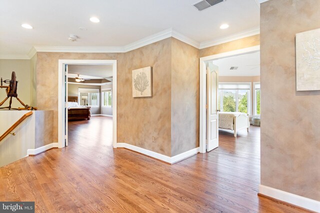 20550 Wildbrook Ct, Ashburn, VA 20147 - hall with wood finished floors, baseboards, ornamental molding, and recessed lighting