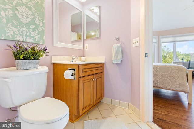 20550 Wildbrook Ct, Ashburn, VA 20147 - bathroom with toilet, vanity, baseboards, and tile patterned flooring