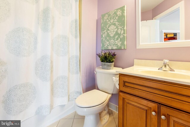 20550 Wildbrook Ct, Ashburn, VA 20147 - full bathroom featuring tile patterned floors, vanity, toilet, baseboards, and shower / bath combo with shower curtain