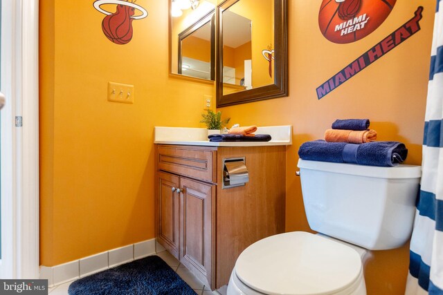 20550 Wildbrook Ct, Ashburn, VA 20147 - bathroom featuring toilet, vanity, tile patterned flooring, and baseboards