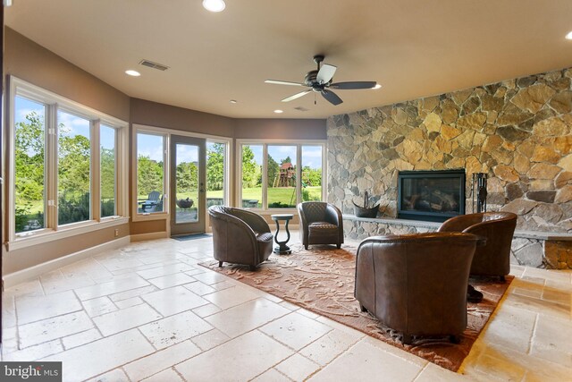 20550 Wildbrook Ct, Ashburn, VA 20147 - living area with stone tile floors, ceiling fan, recessed lighting, a fireplace, and baseboards