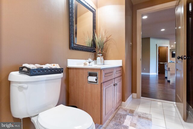 20550 Wildbrook Ct, Ashburn, VA 20147 - bathroom featuring toilet, vanity, tile patterned flooring, recessed lighting, and baseboards